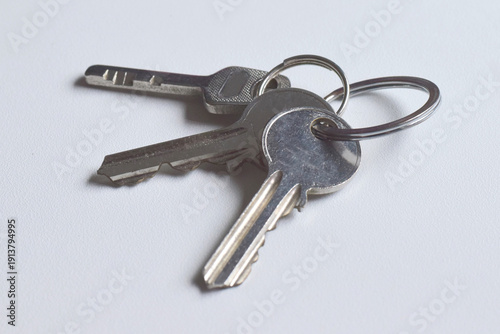 Three keys or a set of keys on a white background.