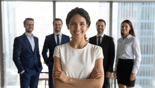 Successful Latin businesswoman leading team in modern office