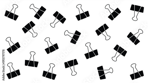 Multiple black binder clips on white background for office organization