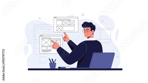 Web designer working on wireframes and user interfaces on computer