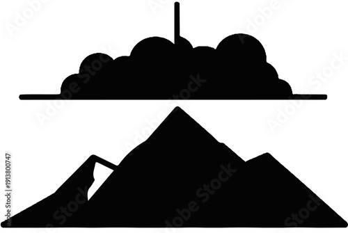 Silhouette of a mountaintop against a cloudy sky