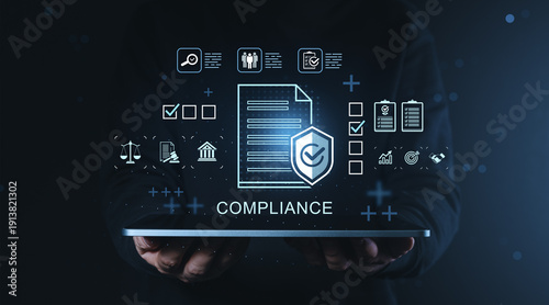 Fotografía Compliance management concept with document and security icons floating above digital tablet held in hands on dark blue business background