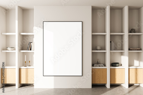 Tableau sur toile Contemporary interior with blank poster mockup on white wall surrounded by minimalist built-in shelves in neutral-toned room with natural light
