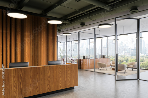 Cuadro en lienzo Contemporary office interior with wooden reception desk and glass meeting room overlooking city skyline in bright daylight setting