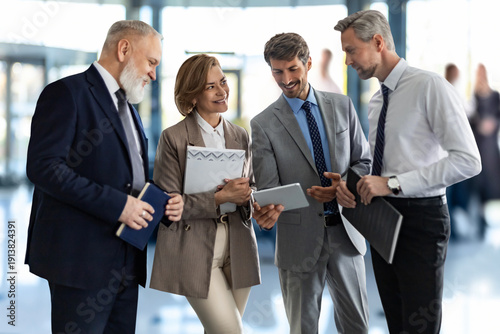 Business team discussing together business plans in office.