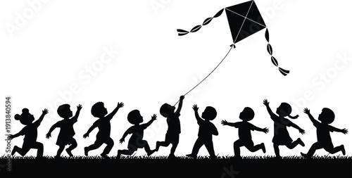 Silhouette of happy kids running freely across a grassy field under a bright sky with a flying kite