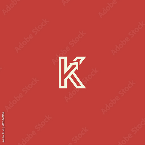 Minimalist vector letter K logo design with an upward arrow integrated into the typography, presented on a solid dark coral background.