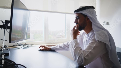 Men with dish dasha working in business office of Dubai. Portraits of  successful businessmen in traditional emirates white dress. Concept about middle eastern cultures.	