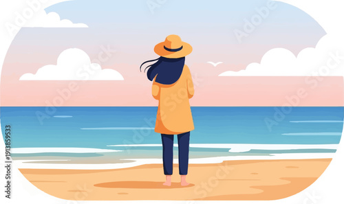 Person in hat and coat looks out at the ocean from a sandy beach