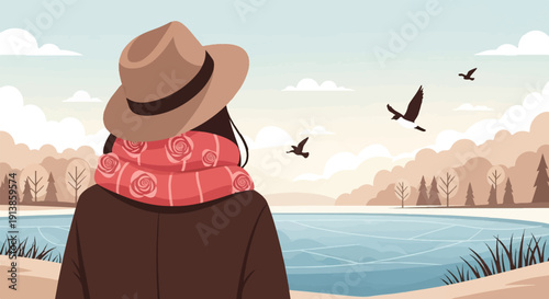 Person in hat and scarf watches birds fly over a frozen lake and distant trees