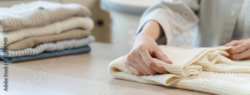 Canvas Print Housewife folding laundry clothes prepare before put in closet