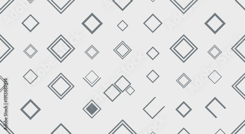 Abstract geometric pattern featuring various grey diamond shapes on a light background, creating a modern and minimalist design.