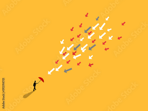 businessman held an umbrella to protect himself from arrow attacks