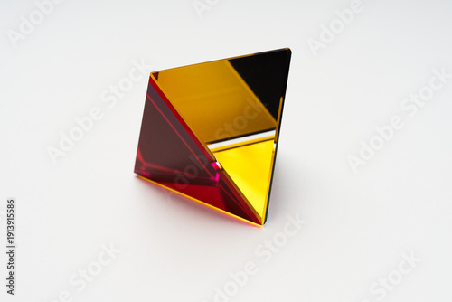 Minimalist 3D Golden Pyramid with Red Transparent Edge Lighting
