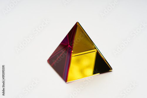 Minimalist 3D Golden Pyramid with Red Transparent Edge Lighting