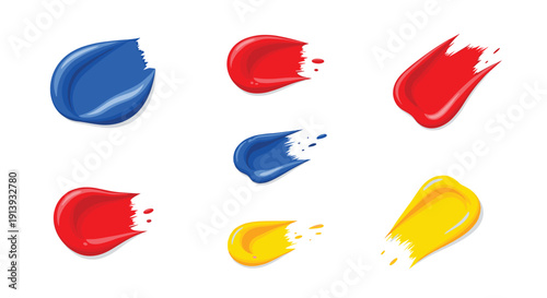 Various abstract paint swatches with liquid splatters in primary red, blue, and yellow on a clean white background.