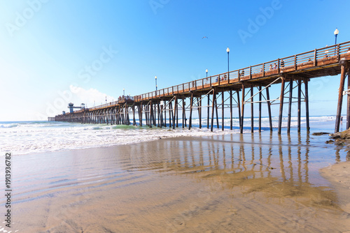 Oceanside Pier Stretching into Pacific Ocean in California on Sunny Day