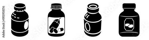 Set of four black vitamin supplement bottles with white labels and dropper lids on white background