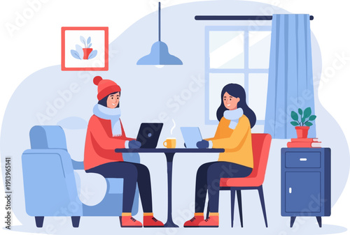 Two people in warm clothes working on laptops in a cozy room