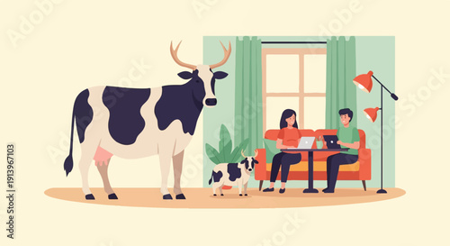 Two people work on laptops while two cows stand nearby in a room