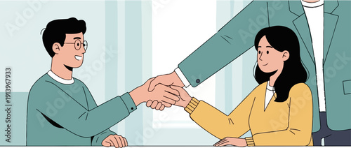 Two people shaking hands across a desk, a third person stands behind