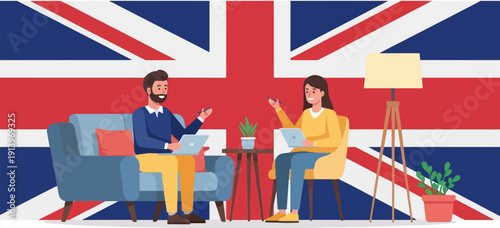 Two people sit in a living room with a large Union Jack flag