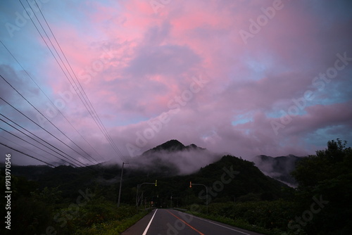 The beautiful pink sunset at the Nissho mountain pass in Hokkaido Japan