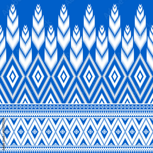 Vibrant blue and white traditional textile pattern. Combining intricate diamond shapes with vertical wheat-like motifs, ideal for fashion prints, home decor, and ethnic art projects.