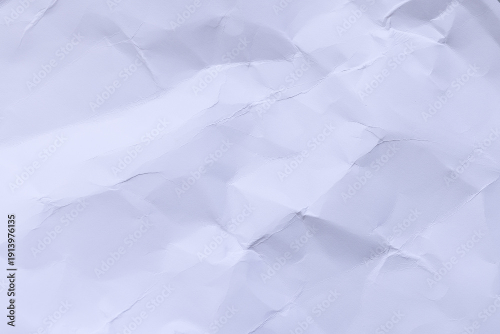 Obraz premium Crumpled white paper texture background with subtle lavender tint,High-resolution macro shot of crumpled and wrinkled white paper. The texture features intricate folds, creases, and shadows, creating 