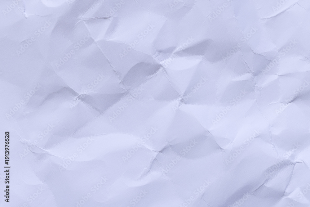 Obraz premium Crumpled white paper texture background with subtle lavender tint,High-resolution macro shot of crumpled and wrinkled white paper. The texture features intricate folds, creases, and shadows, creating 