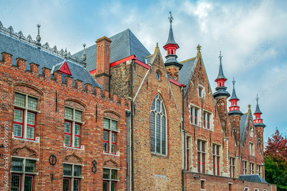 Fototapeta premium Architectural facade detail at old buildingas placed in Bruges, Belgium.