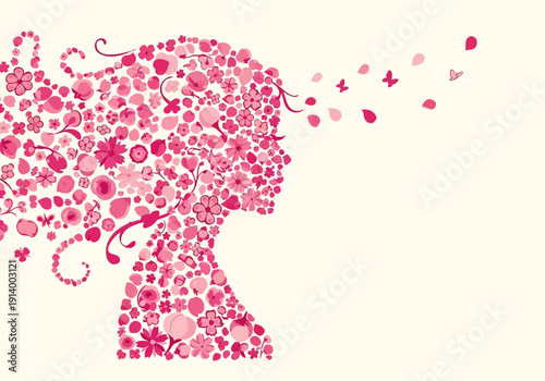 Woman's silhouette made of flowers blowing in the wind