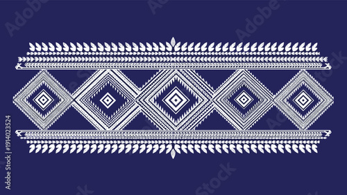 Ethnic geometric pattern with white diamond shapes and decorative borders on dark blue background for fabric design.