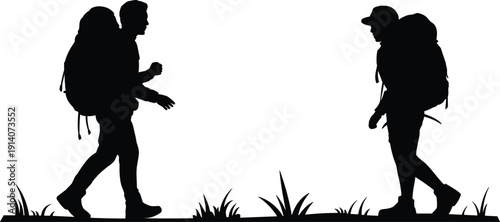 Two hikers with backpacks walking on grass silhouettes Keywords: hiking, backpack, travel, adventure, journey, exploration