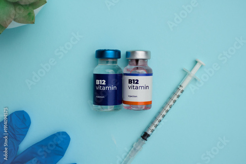 Vitamin B12 injection vials and syringe ready for medical administration