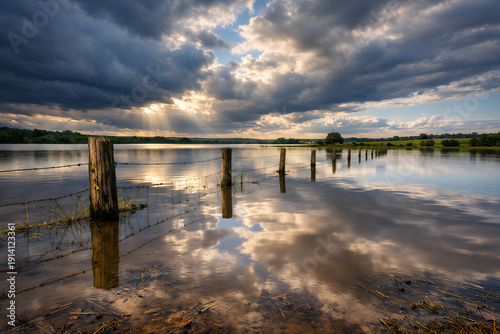 Wallpaper Mural Flooded English Farmland with Wooden Fence Posts Under Dramatic Stormy Sky Torontodigital.ca