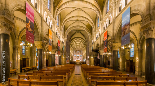 Paris, France - 02 14 2026: Saint Joseph of the Nations Church. Panoramic view of the nave, the aisles with stained glass windows and apse at the back