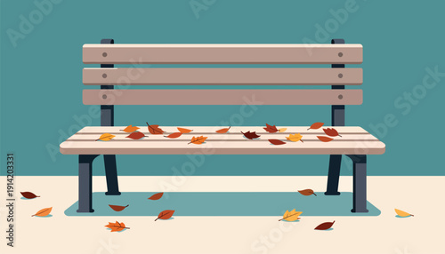Empty park bench scattered with fallen autumn leaves