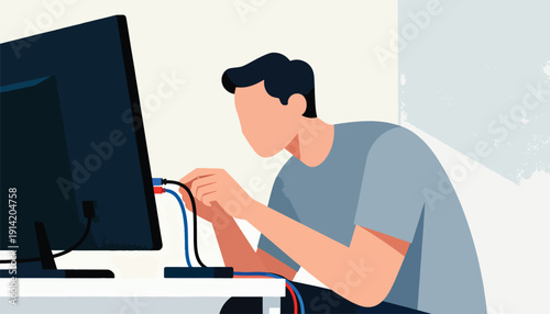 Person connecting colorful cables to a computer monitor on a desk