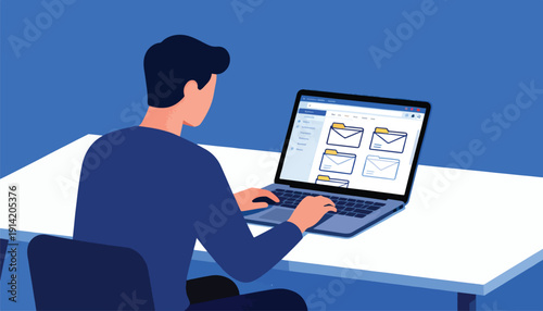Person working on a laptop displaying email folders
