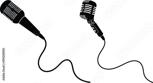 Two microphones with cords on a plain background