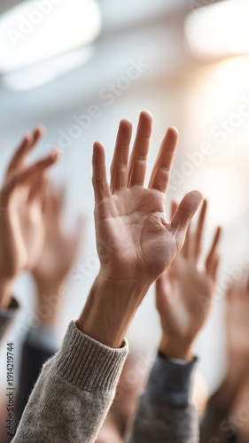 Hands raised in a voting session, capturing a moment of participation and collective decision-making