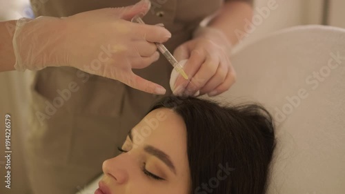 Professional mesotherapy treatment with vitamin injections on female face