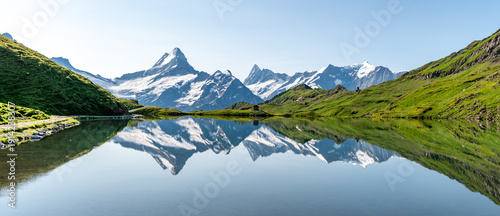 Panel kuchenny z motywem View on the most famous Swiss mountains, Schreckhorn, Eiger, Moench and Jungfrau in the Bernese Highland reflecting in lake Bachsee