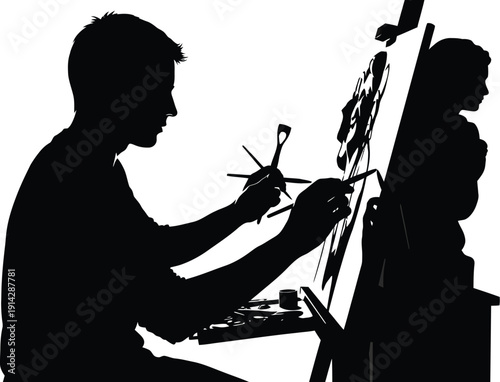 Silhouette of male artist painting on canvas with various art brushes