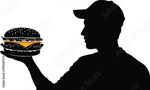 Silhouette of man holding a large cheeseburger in his right hand