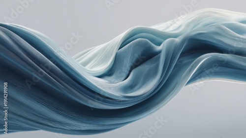 Abstract flowing fabric in soft blue tones creating an elegant smooth texture against a minimalistic background for artistic design and creative projects