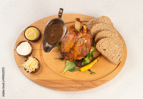 roasted pork knuckle with bread, horseradish and mustard