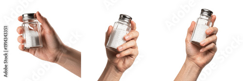 Photos Set and collection of human hand holding glass salt shaker with white sea salt i