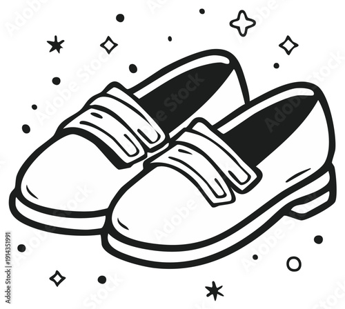 Pair of black and white loafers with decorative elements